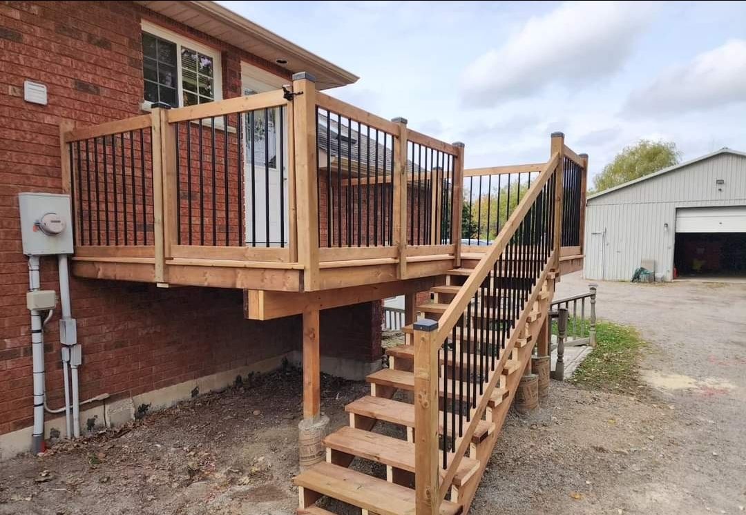 Elevated cedar deck with black railings